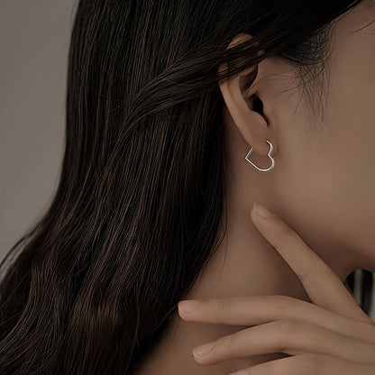 Hjerteformede øreringe i rustfrit stål i guld